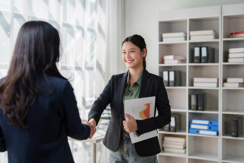 A sales rep closing a deal with a customer